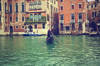 Gondola on Venice Canal with Historic Buildings