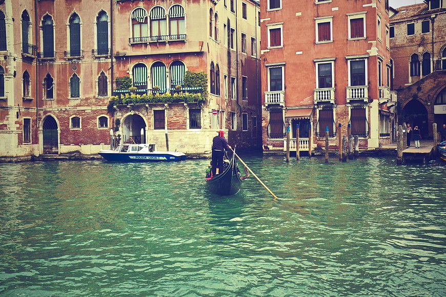 Gondola on Venice Canal with Historic Buildings