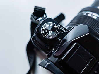 Close-up of Black Mirrorless Camera Mode Dial