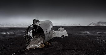 Black and White Plane Wreckage on Black Sand Beach