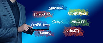 Businessman Holding Tablet With Skill Development Keywords On Blue Background