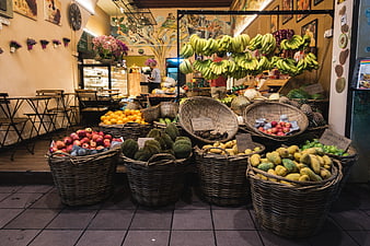 Exotic fruit market display with bananas and durian