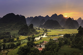 Sunrise Over Karst Mountains And Rice Paddies In Rural Vietnam