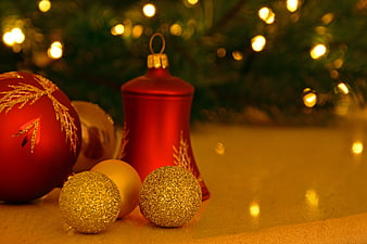 Red and Gold Christmas Ornaments with Glittery Baubles and Warm Bokeh Lights