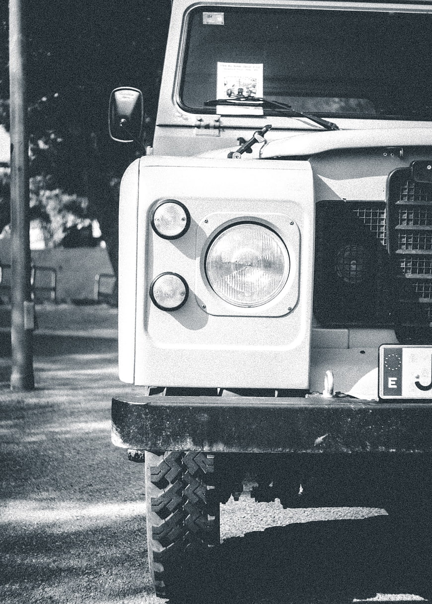 Close-up of vintage Land Rover Defender front headlight
