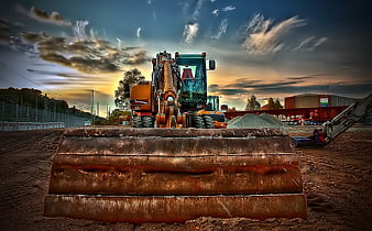Rusty Excavator Bucket on Construction Site at Sunset