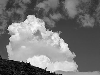 Dramatic Black and White Cumulus Cloud Over Hillside