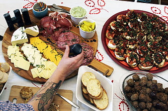 Gourmet Charcuterie Board and Appetizers on Table