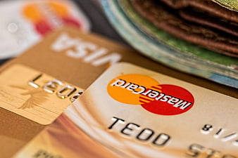 Close-up of credit cards and cash in a wallet
