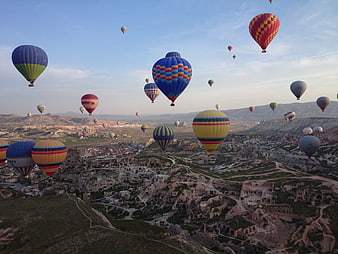 Hot Air Balloons Flying Over Cappadocia Landscape