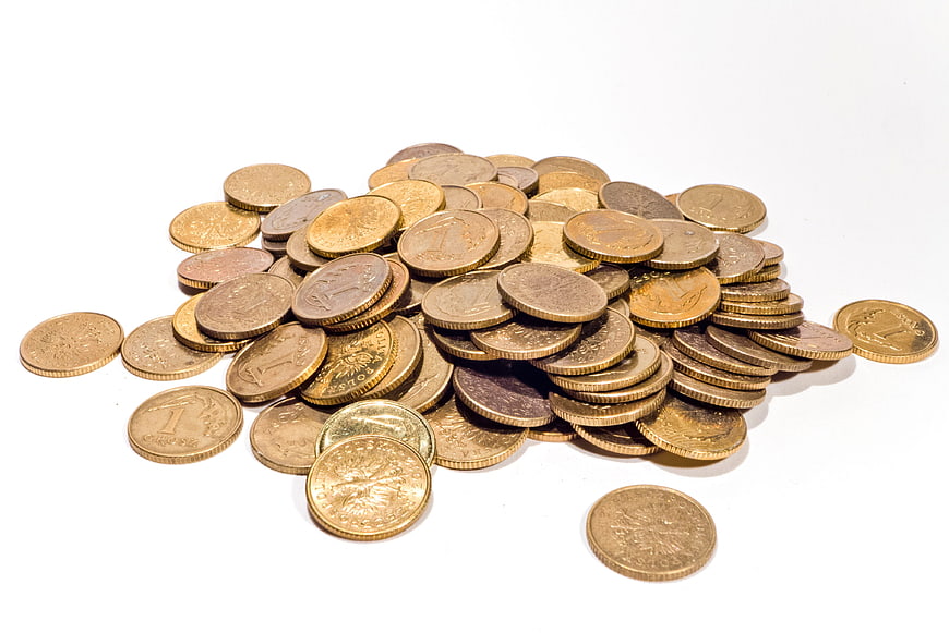 Pile of gold coins on white background