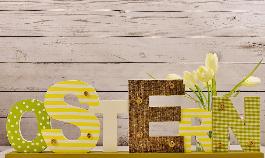 Easter Wooden Letters With Yellow Tulips On White Rustic Wood Background