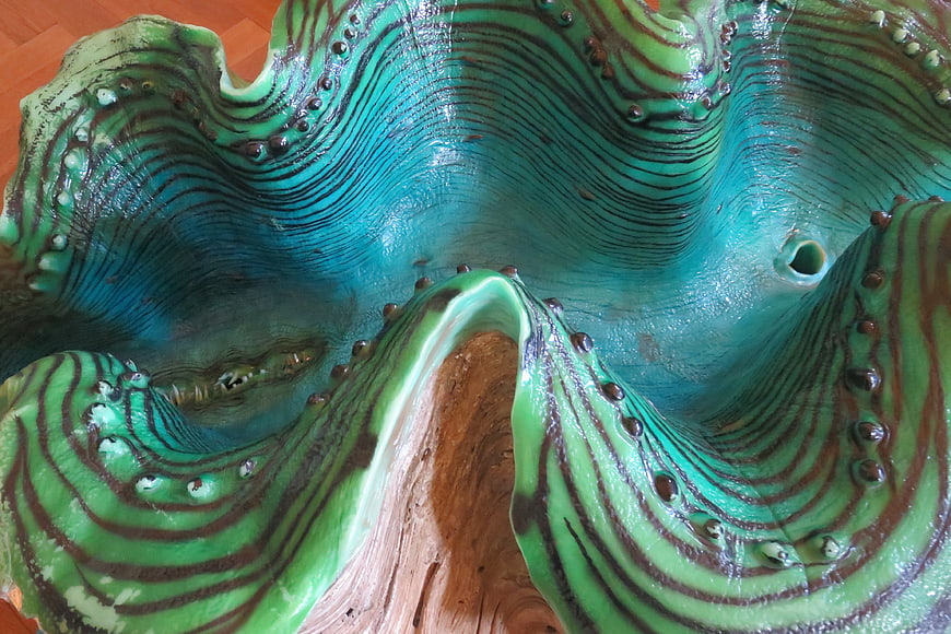Close-up of a vibrant green and blue giant clam model texture