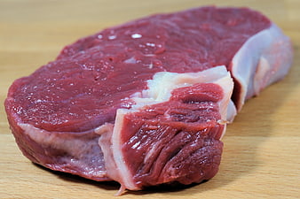 Fresh Raw Beef Steak on Wooden Cutting Board
