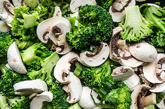 Fresh Sliced Mushrooms and Broccoli Florets Close-Up