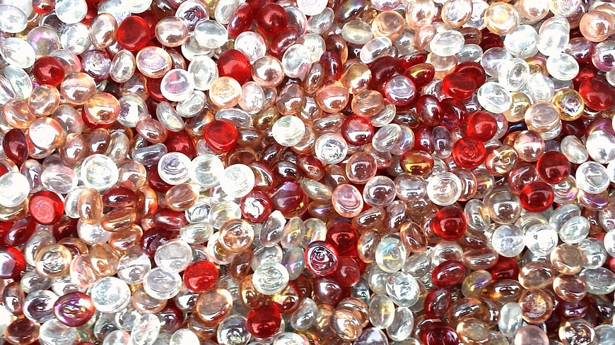 Close-up of red and clear glass beads texture background