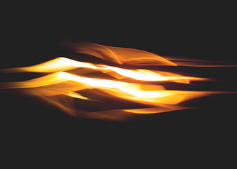 Abstract Orange Light Trails on Black Background