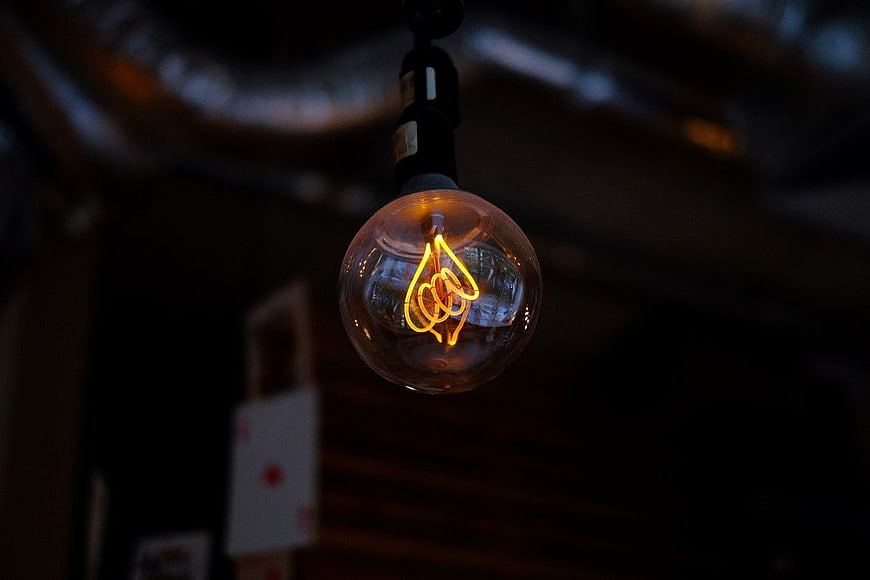 Glowing Vintage Edison Lightbulb in Dark Setting