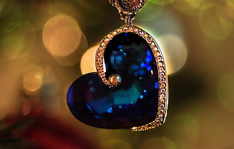 Luxurious Heart-Shaped Sapphire Pendant With Gold And Diamond Details