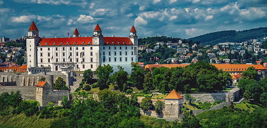 Bratislava Castle Panorama With Red Roofs And Green Hills