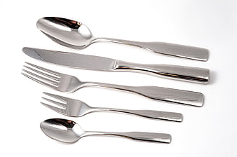 Silver Cutlery Set Arrangement On White Background