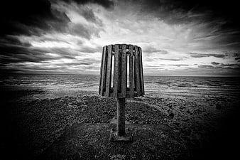 Moody Black and White Coastal Scene with Wooden Structure