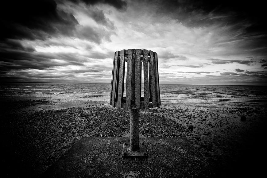 Moody Black and White Coastal Scene with Wooden Structure