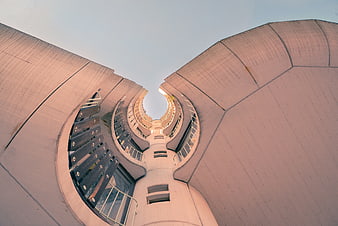 Low angle view of curved modernist concrete architecture