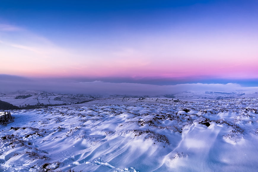 Snowy Winter Landscape with Pink and Blue Twilight Sky