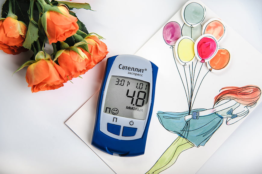 Blue Blood Glucose Meter With Orange Roses And Illustration
