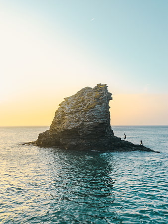 Aerial View of Sea Stack at Sunset with Two People