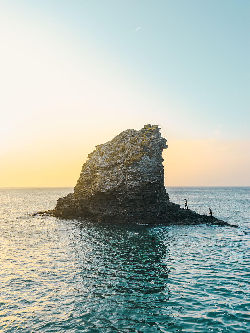 Aerial View of Sea Stack at Sunset with Two People