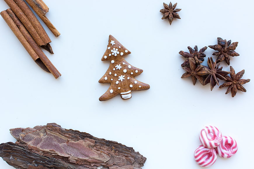 Christmas gingerbread tree with cinnamon and star anise on white