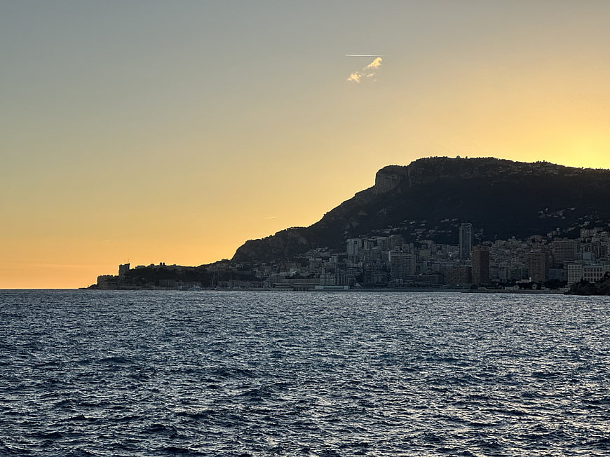 Monaco coastline silhouette at sunset over the Mediterranean sea