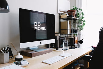 Modern Minimalist Home Office Workspace With Apple iMac And Wooden Desk