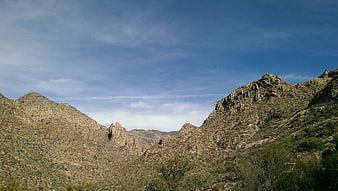 Rugged desert mountain landscape under blue sky