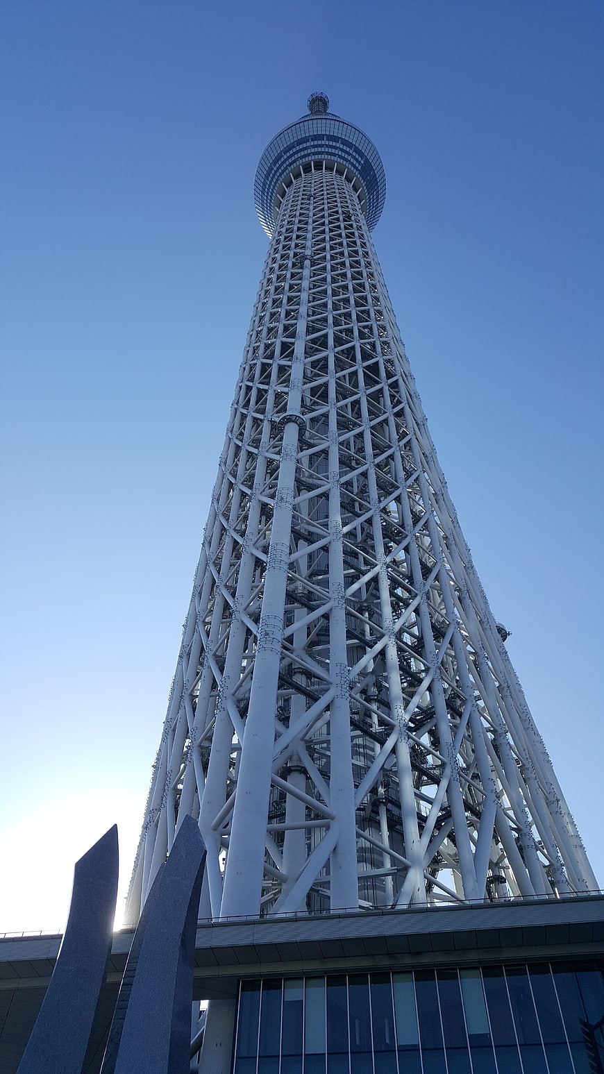 Low angle view of Tokyo Skytree against blue sky