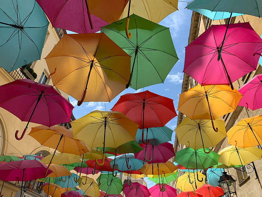 Colorful umbrellas hanging over a European street