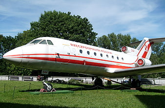 White and red Polish government jet on display outdoors