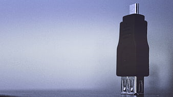 Black USB Cable Connector on Blue Gradient Background