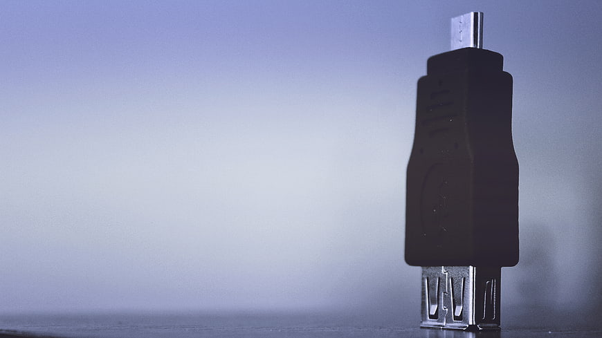 Black USB Cable Connector on Blue Gradient Background