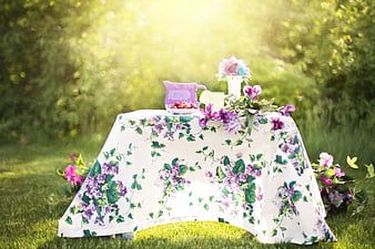 Summer Garden Tea Party Setup with Floral Tablecloth