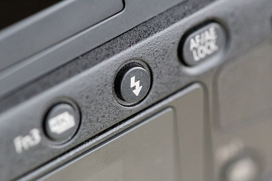 Close-up of camera flash button and controls
