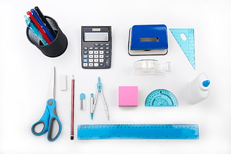 Flat lay of colorful school supplies on white background
