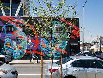 Vibrant Street Art Mural on Urban Building Wall
