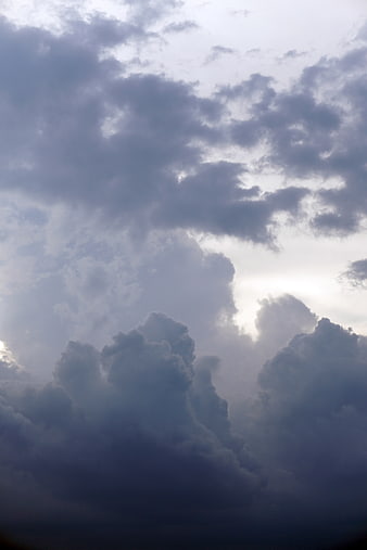 Dramatic Dark Storm Clouds with Sunlight Breaking Through