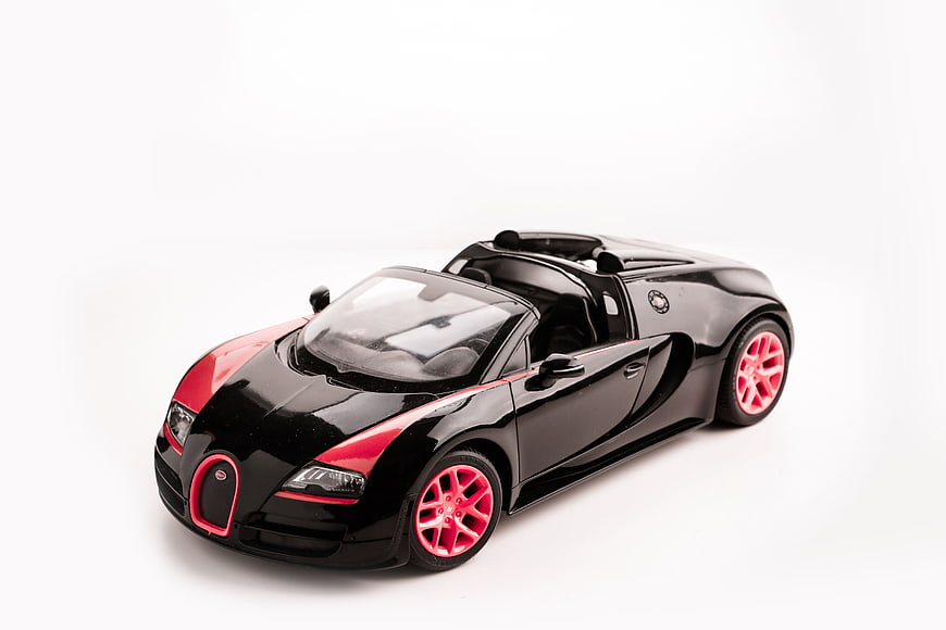 Black and Red Bugatti Veyron Model Car on White Background