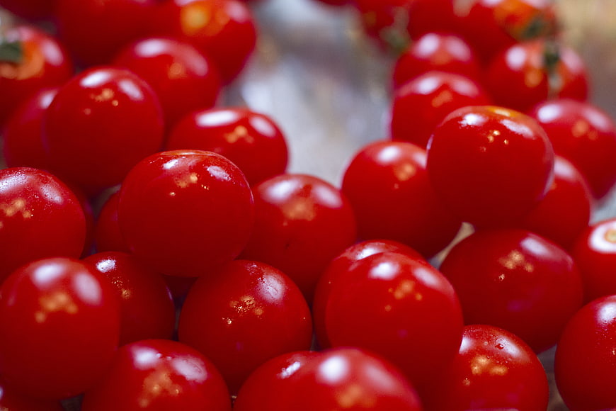 Close-up of fresh red cherry tomatoes with shallow depth of field