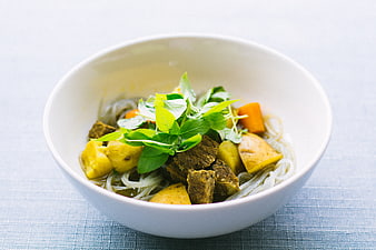 Bowl of Thai Green Curry with Beef and Rice Noodles