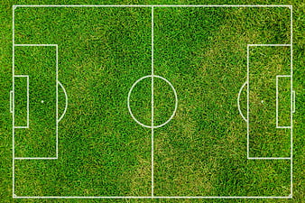 Aerial view of a green soccer field with white lines